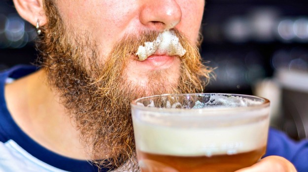 bearded man drinking beer | Manly Hobbies To Earn Money On The Side 