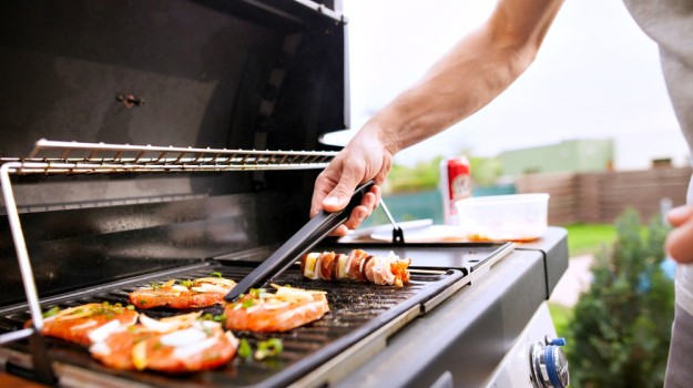 person grilling meat | Manly Hobbies To Earn Money On The Side