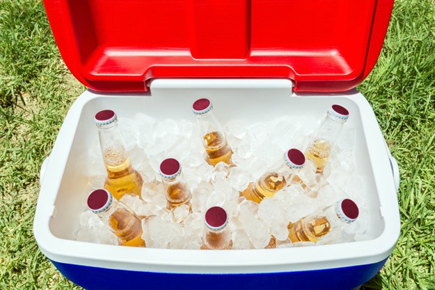 cooler with ice and beers | Camping Checklist For The Wild Man