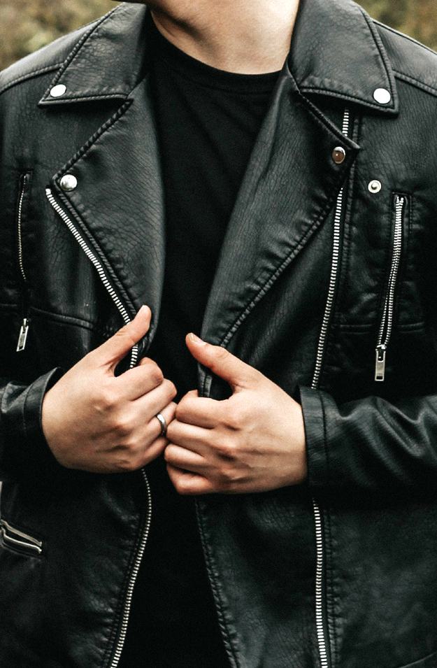 man wearing leather jacket | Must Have Travel Items For Men To Survive Your Next Holiday Getaway