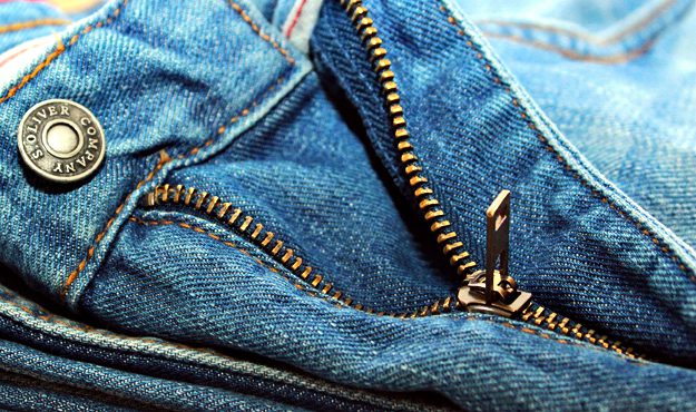 zipper and jeans | Must Have Travel Items For Men To Survive Your Next Holiday Getaway