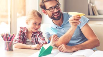Feature | father and daughter playing paper planes | How To Make Paper Airplanes That Don’t Suck | paper airplanes