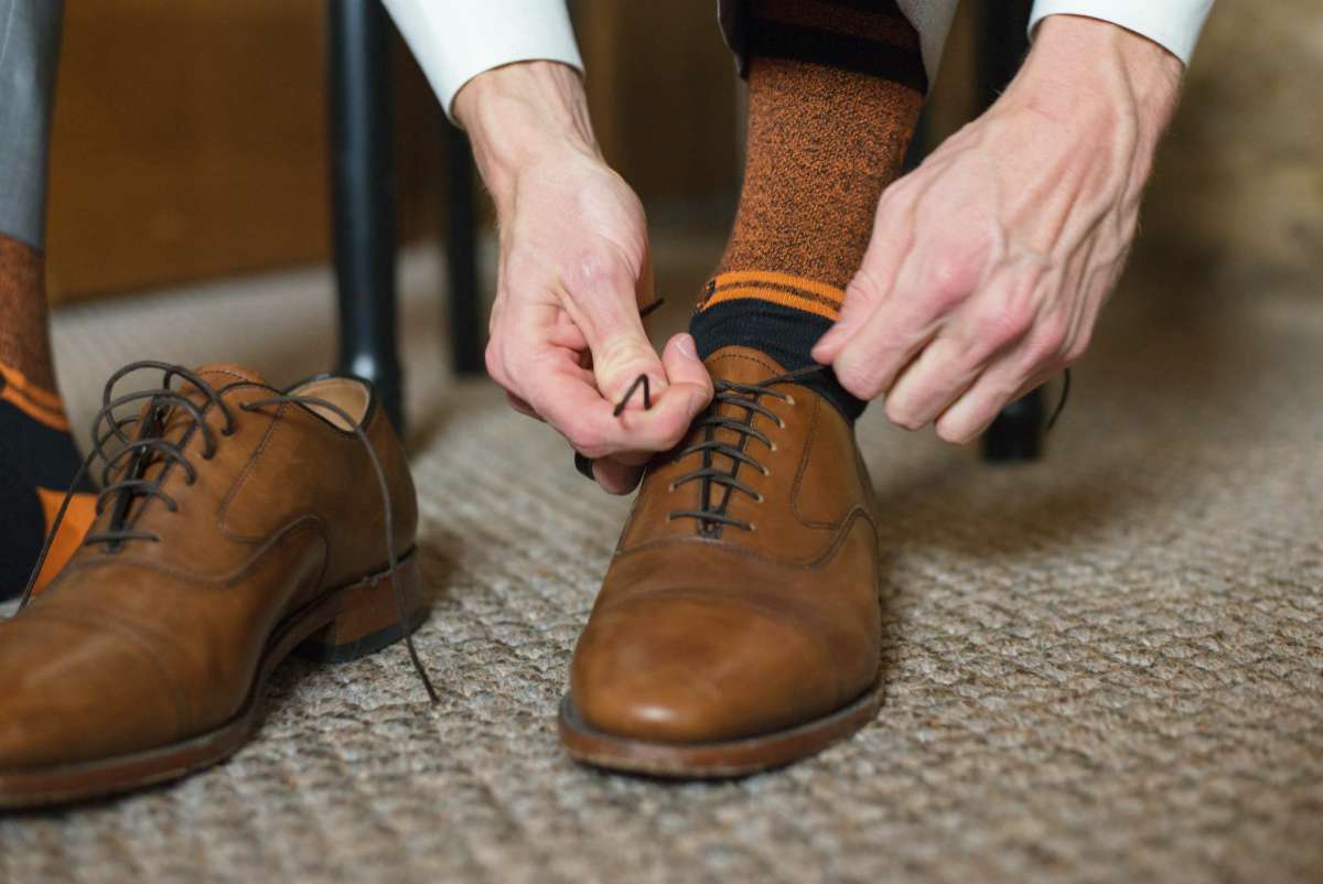 man tying shoes formal wear | How to Survive Your Mother In Law